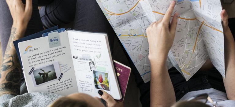 Travel bloggers planning for a trip